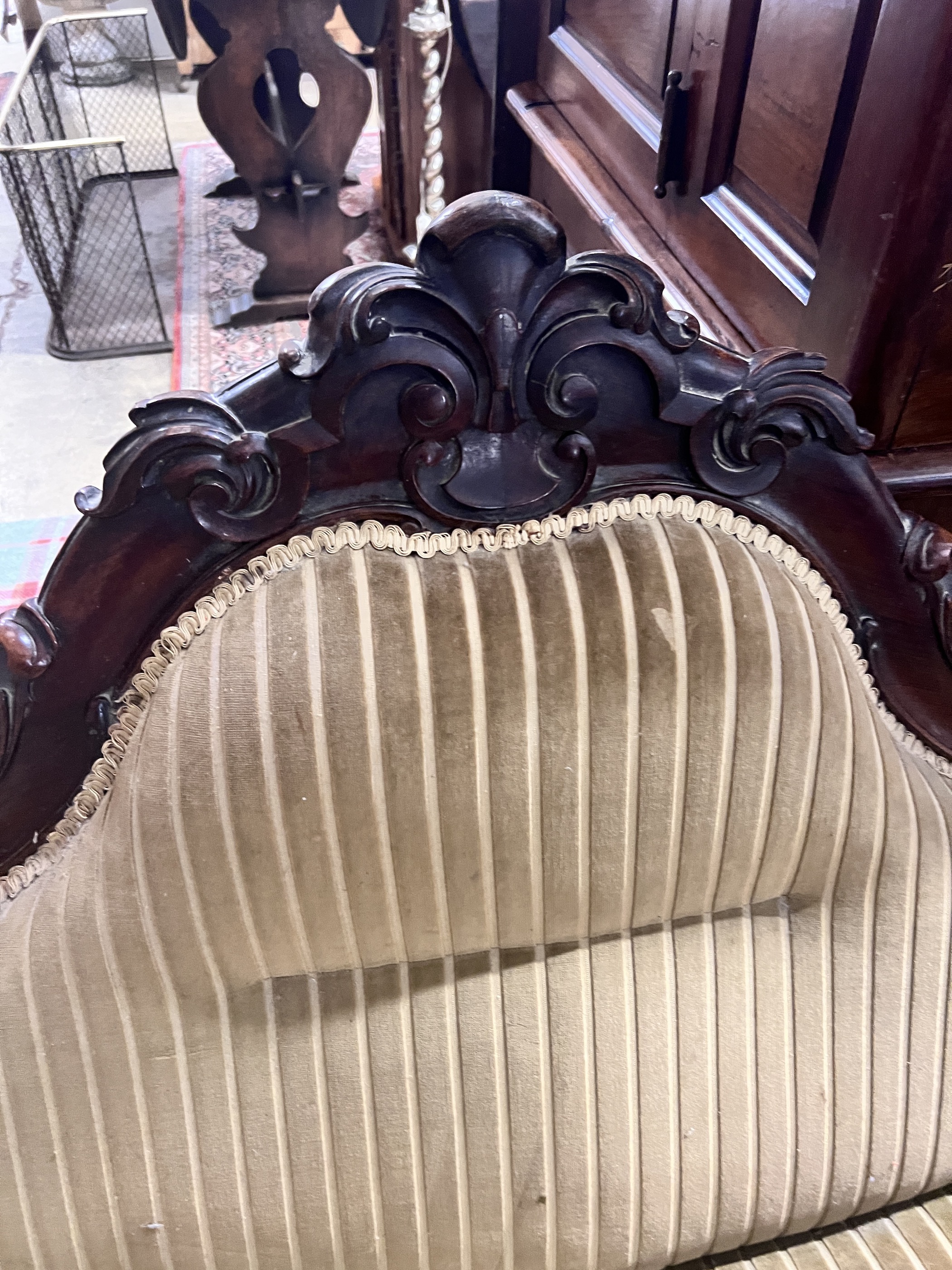 A Victorian carved mahogany settee, length 190cm, width 74cm, height 93cm